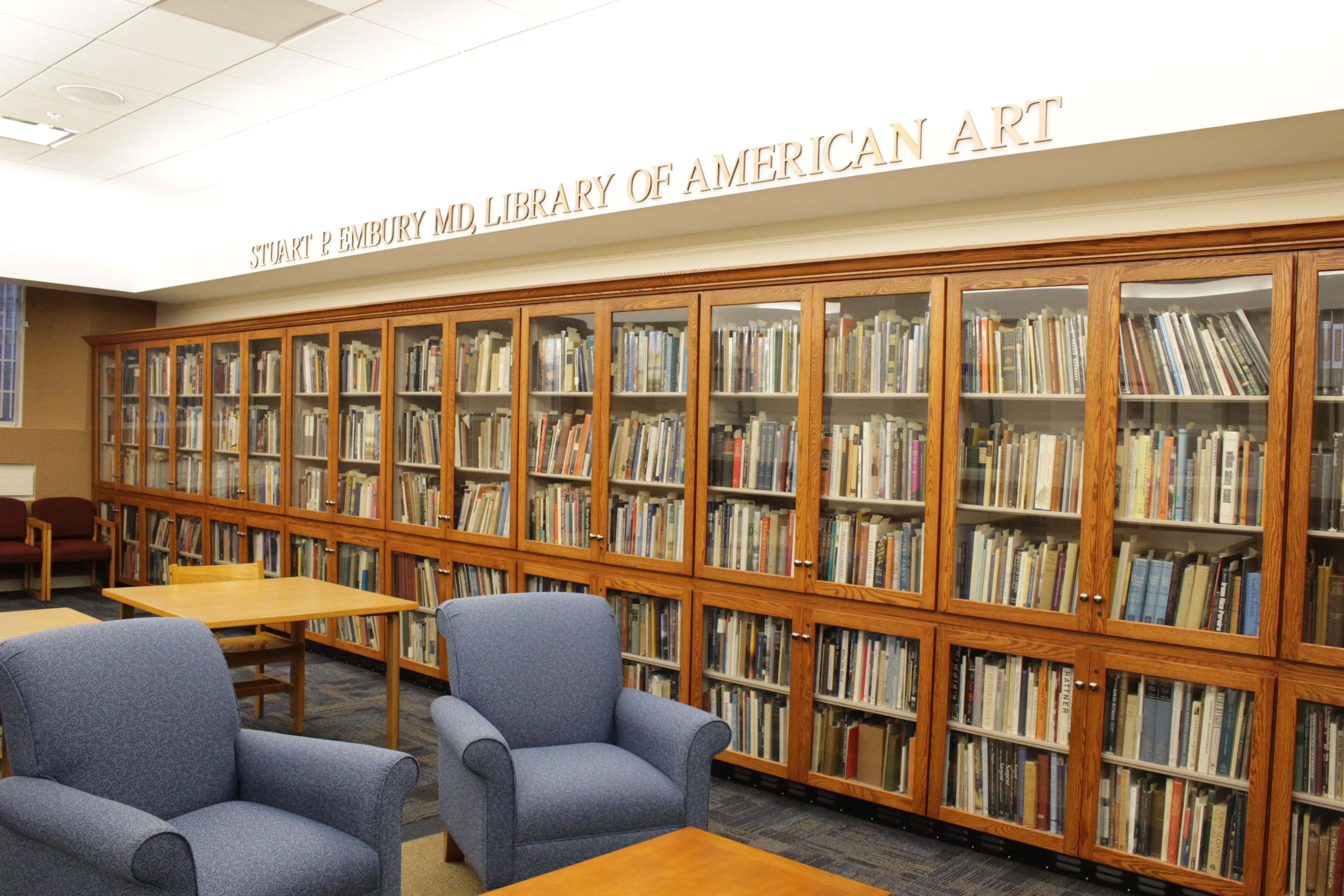 Stuart P Embury Collect of books on shelves in Archives and Special Collections